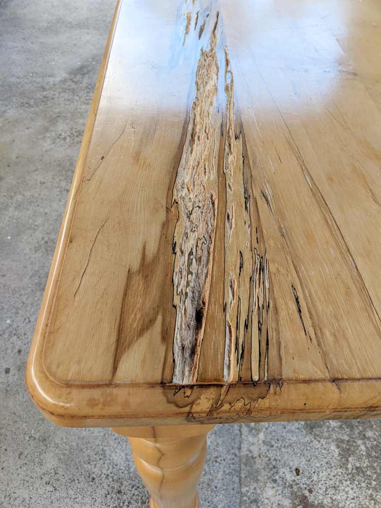 This black heart sassafras dining table arrived with a large rotten patch that needed filling